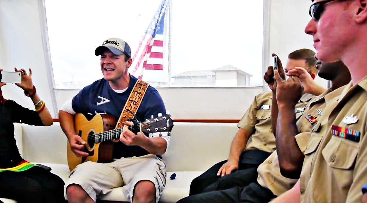 ‘Idol’ Alum John Wayne Shulz Honors Troops With ‘American Soldier’ Cover At Pearl Harbor | Country Music Videos