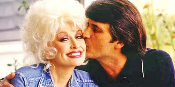 Dolly Parton gets a kiss on the cheek from her husband, Carl Dean