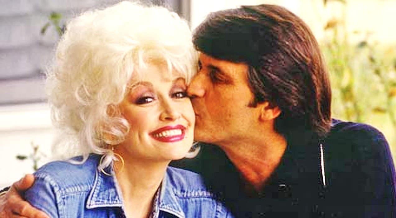 Dolly Parton gets a kiss on the cheek from her husband, Carl Dean