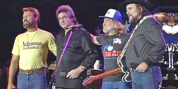 Johnny Cash collaborates with Waylon Jennings in their supergroup The Highwaymen at Willie Nelson's Farm Aid