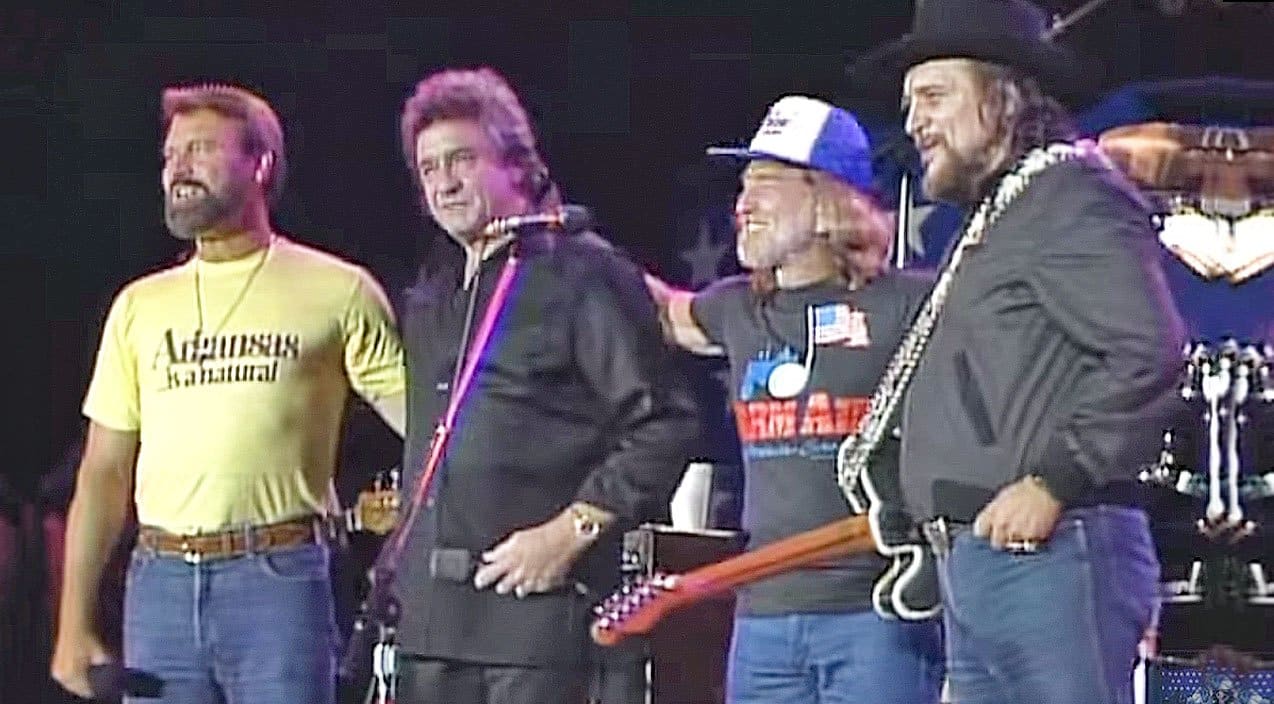 Johnny Cash collaborates with Waylon Jennings in their supergroup The Highwaymen at Willie Nelson's Farm Aid