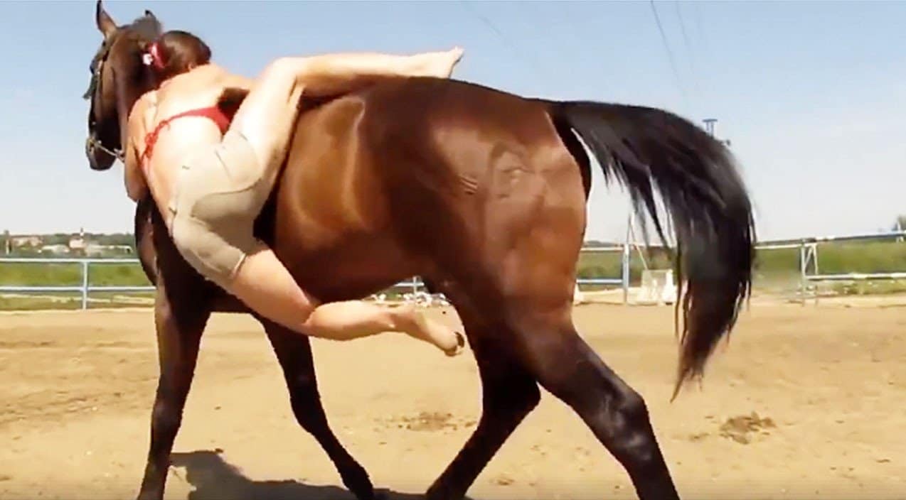 the rider continued to kick one foot along the horse's side in hopes o...