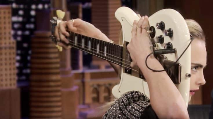Cara Delevingne Plays ‘Sweet Home Alabama’ Riff On Guitar Behind Her Head | Country Music Videos