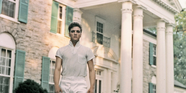 Elvis Presley outside of his Graceland mansion in Memphis, Tennessee, which a woman has recently been arrested for allegedly trying to steal