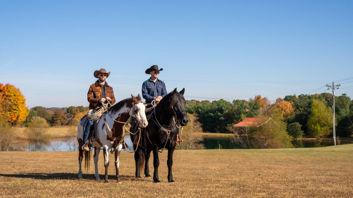 Kevin and Darin riding horses.