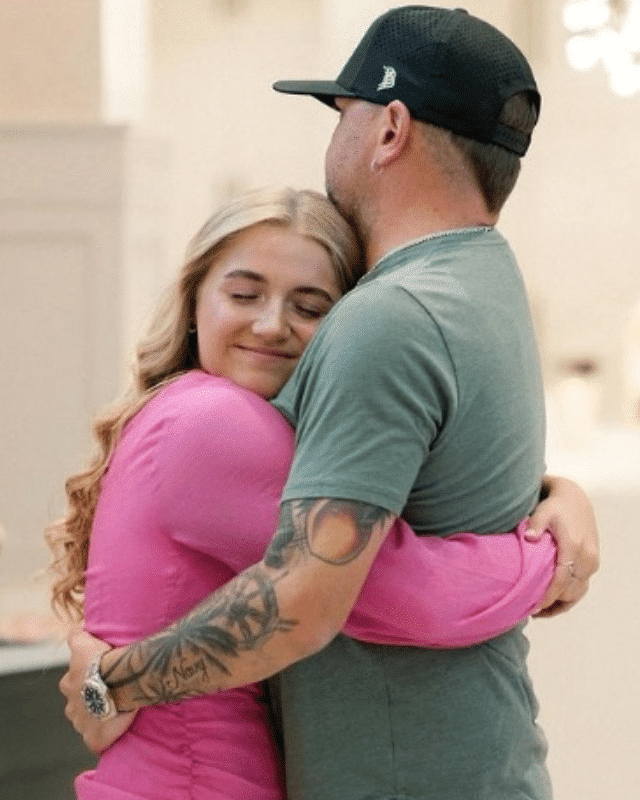Jason Aldean hugs his daughter Kendyl at her sixteenth birthday party