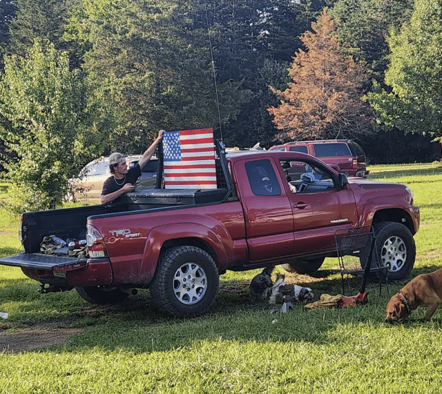 Christopher Hartless proudly displays an American flag on his pickup truck