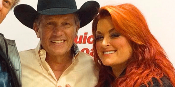 Photo of Wynonna and George Strait hugging.