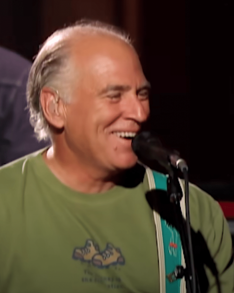 Jimmy Buffett smiling in his performance with Zach Brown Band on an episode of CMT's Crossroads.