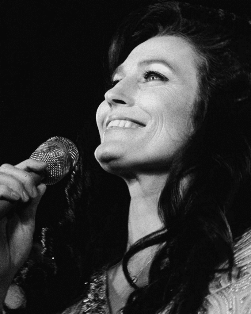 American country music singer and guitarist Loretta Lynn performs on stage in California, 1972.