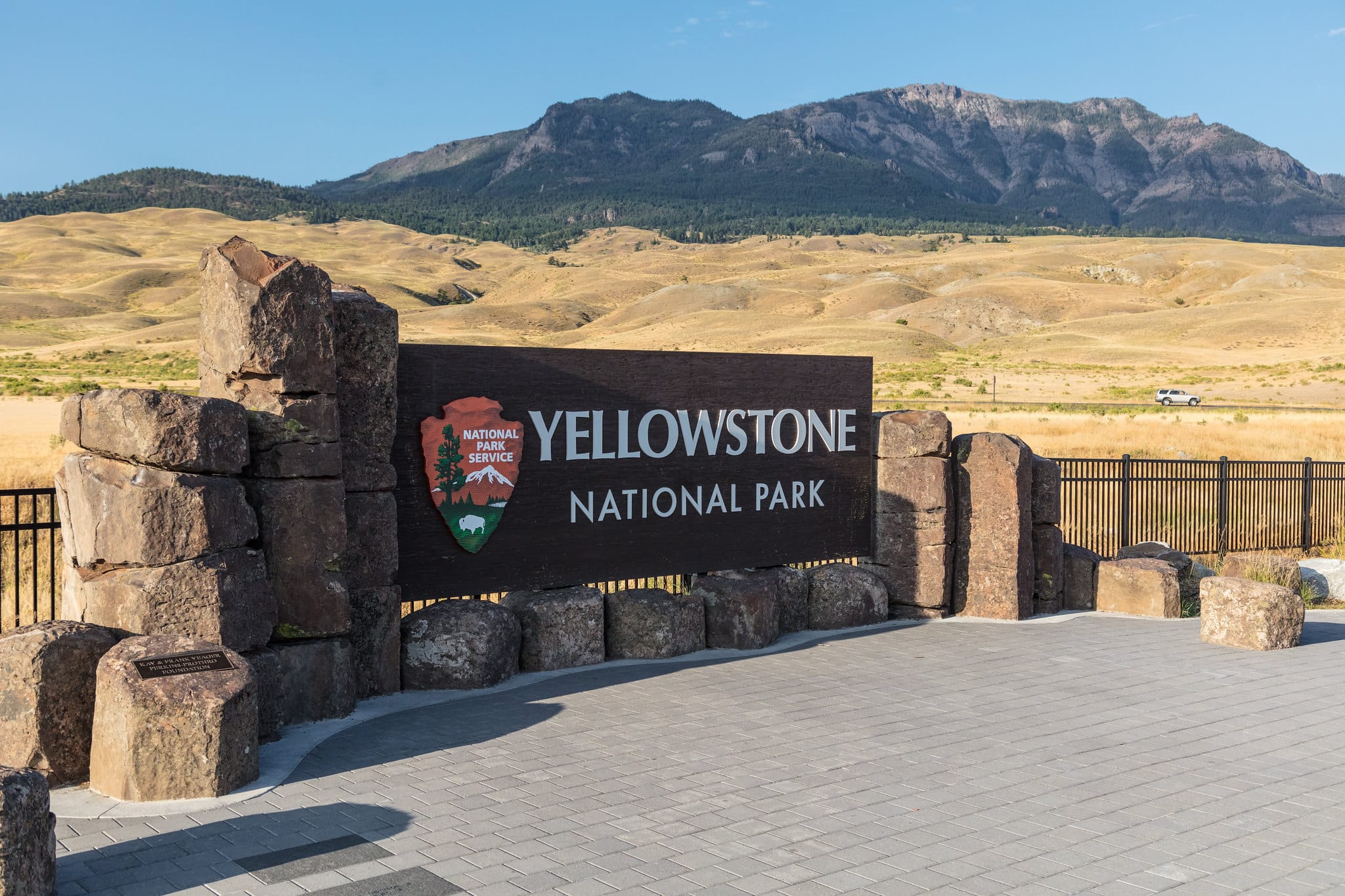 Park Entrance sign and Sepulcher Mountain at Yellowstone.