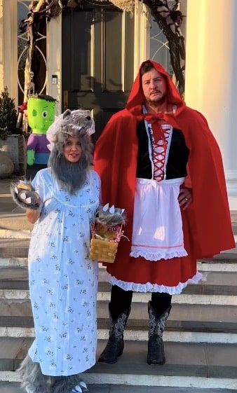 Luke Bryan's Halloween costume from 2023. He dressed as Little Red Riding Hood, and his wife Caroline Bryan was the Big Bad Wolf