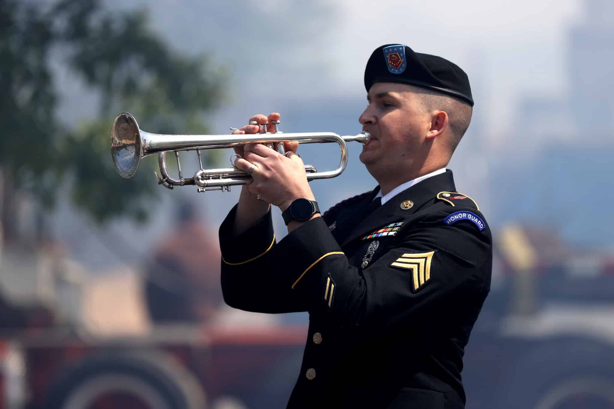 Boston, MA - May 25: A member of the armed forces plays Taps at the Fallen Heroes Memorial 8th Annual Rededication Ceremony. (Photo by Jonathan Wiggs/The Boston Globe via Getty Images)