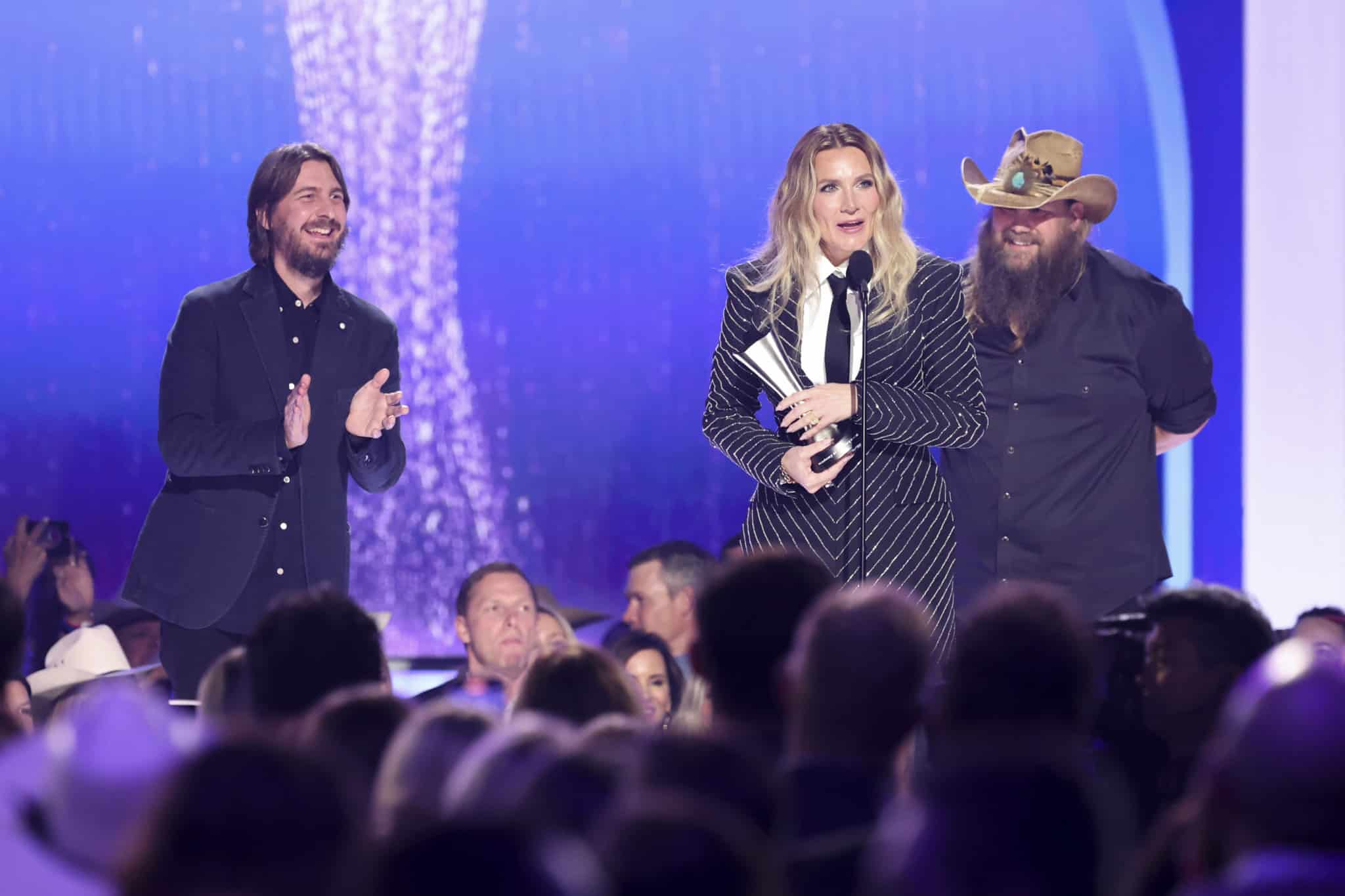 Morgane Stapleton accepts her first ACM Award (for Album of the Year) while co-producers Chris Stapleton and Dave Cobb look on