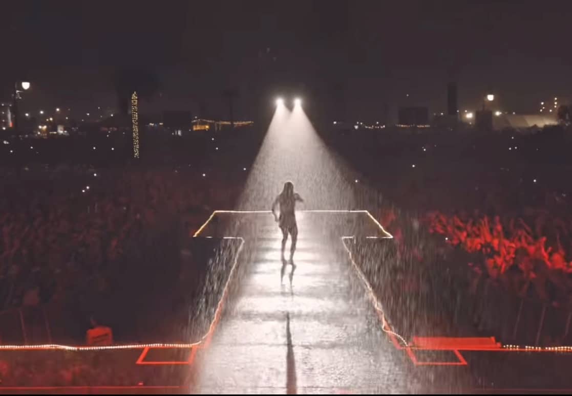 Carrie Underwood performing in "massive downpour"
