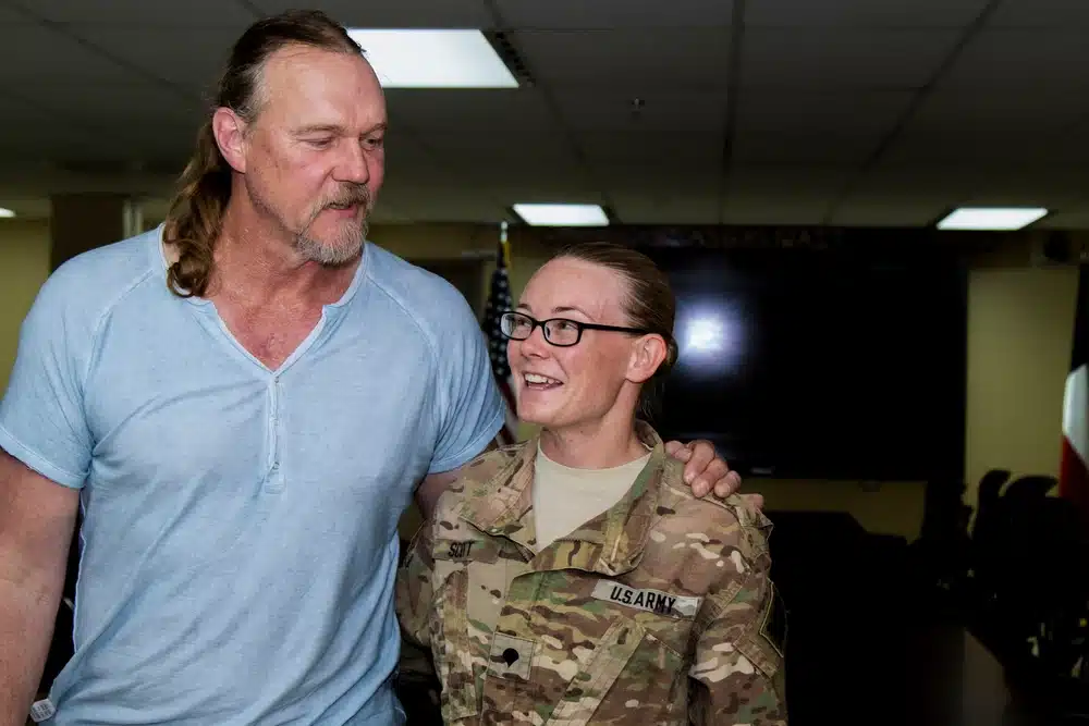 Country music star Trace Adkins poses with a Soldier at Camp Arifjan, Kuwait as part of the USO’s 75th Anniversary Concert Series, June 8. Adkins spent time with troops answering questions, signing autographs, posing for photos and also performed a concert to show his support for the United States military. (Photo by Spc. Angela Lorden/Released)