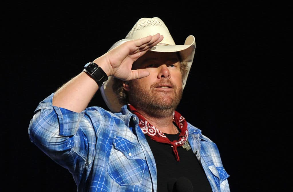 LAS VEGAS, NV - APRIL 07: Musician Toby Keith performs onstage during ACM Presents: An All-Star Salute To The Troops at the MGM Grand Garden Arena on April 7, 2014 in Las Vegas, Nevada. (Photo by Kevin Winter/ACMA2014/Getty Images for ACM)