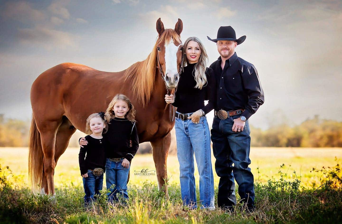 Cody Johnson with his wife and two daughters.