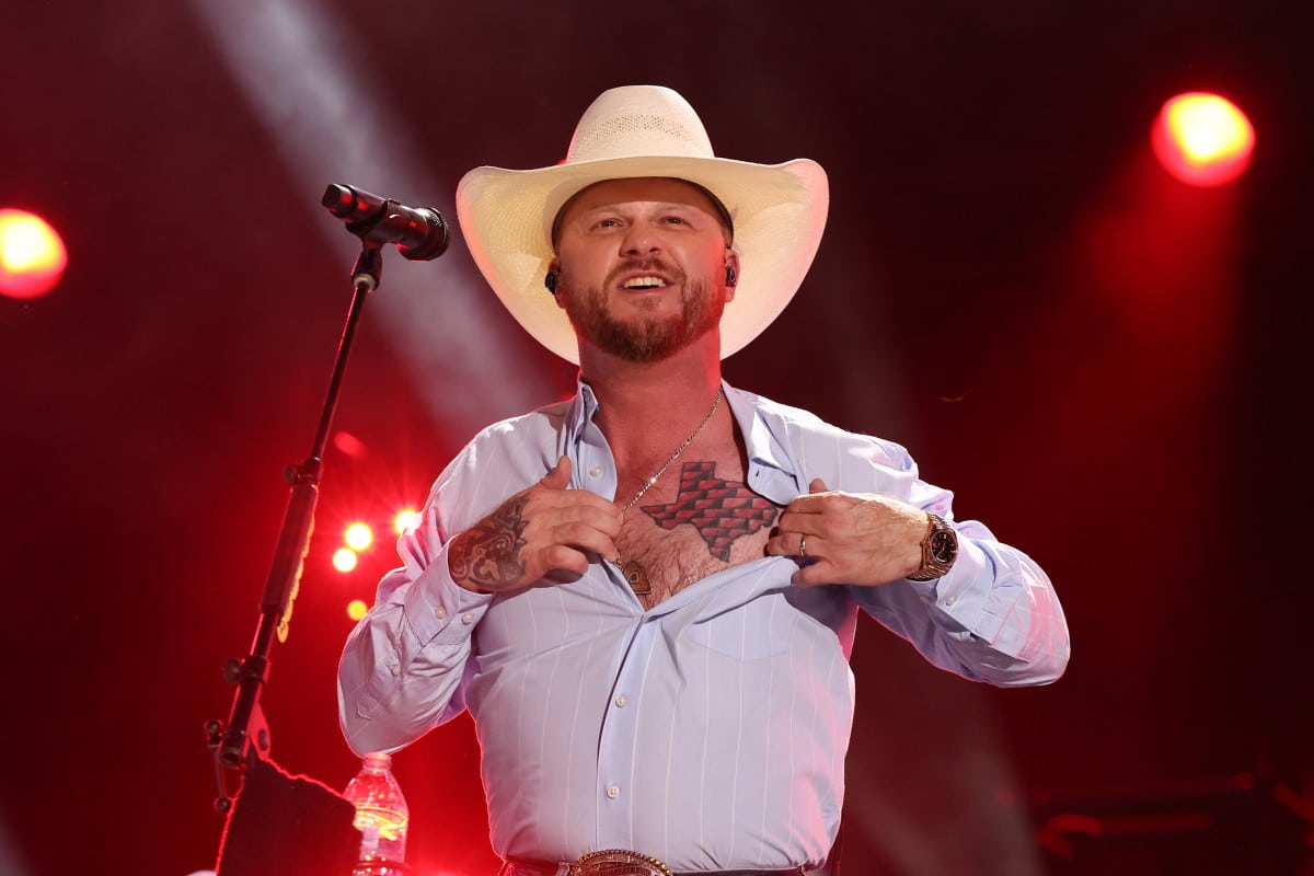 Cody Johnson shows off his "red bricks of Texas" chest tattoo