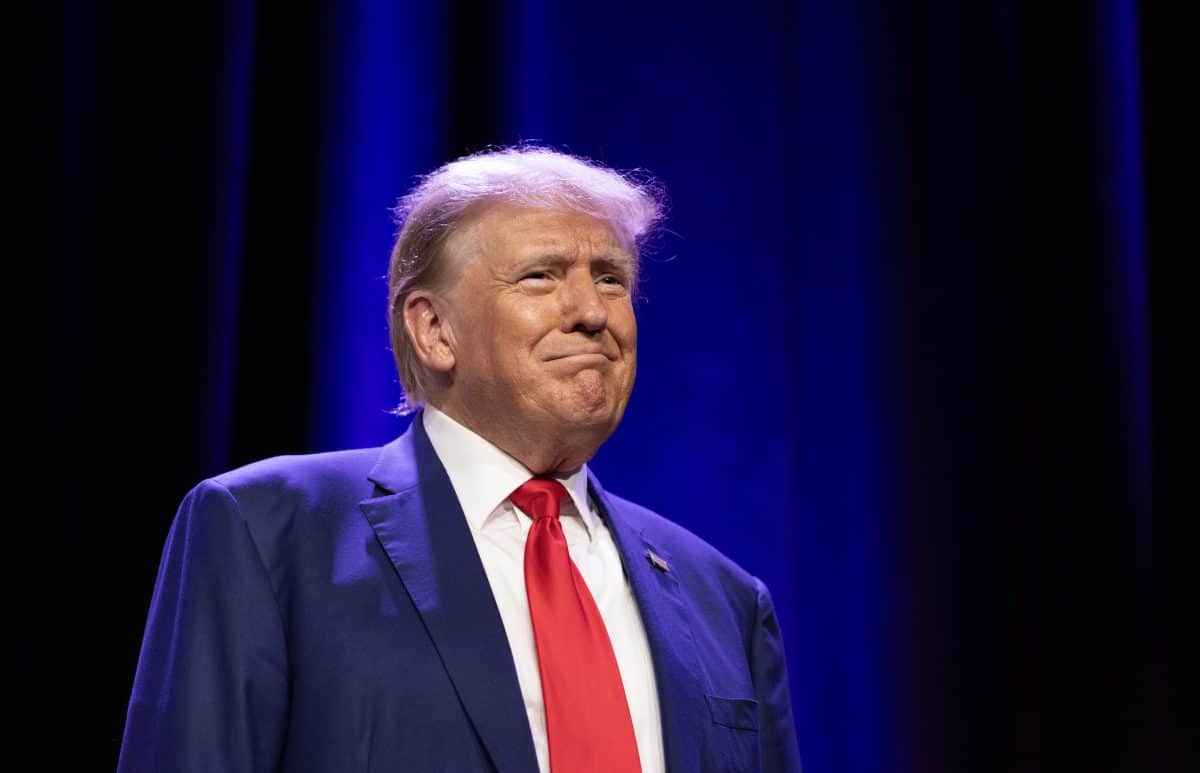 DES MOINES, IA - JULY 28: Republican candidate for president President Donald J. Trump pauses to look out over the cheering crowd as he enters the stage to speak during the Republican Party of Iowa 2023 Lincoln Dinner at the Iowa Events Center in Des Moines, Iowa, Friday, July 28, 2023.