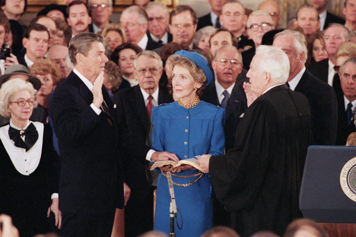 President Reagan is sworn in by Chief Justice Warren Burger in the Capitol Rotunda in a public inauguration ceremony.