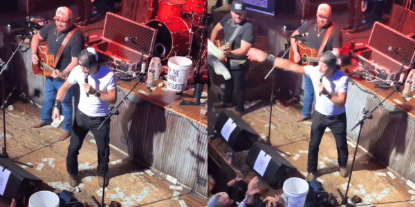 Kid Rock throws cash during a surprise appearance at his Nashville Bar