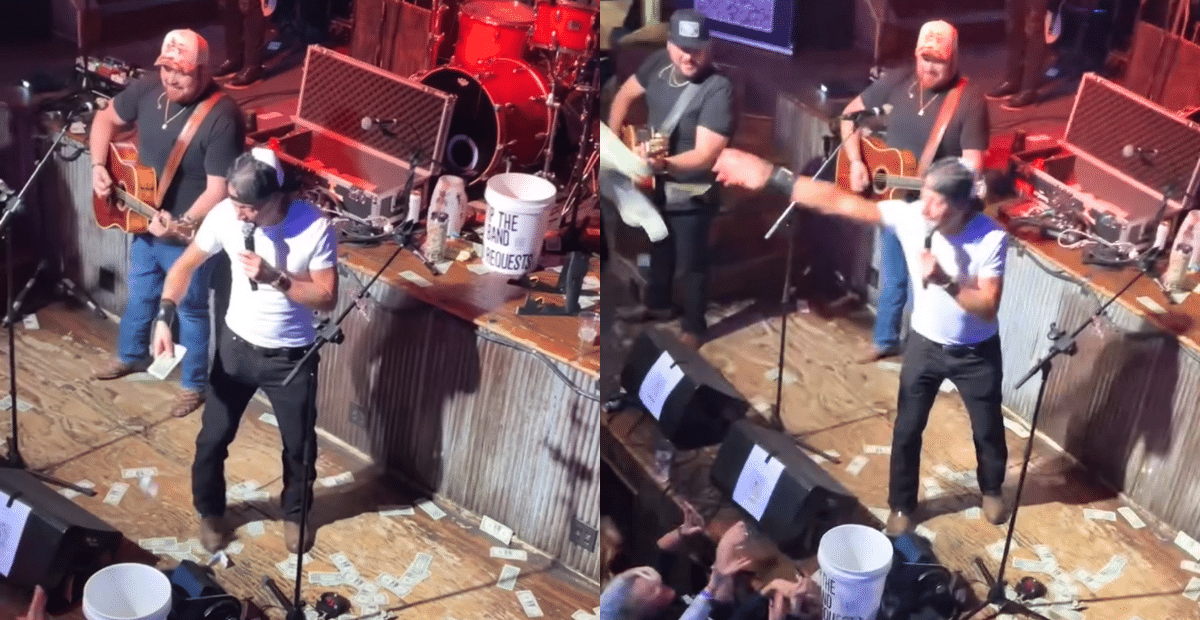 Kid Rock throws cash during a surprise appearance at his Nashville Bar