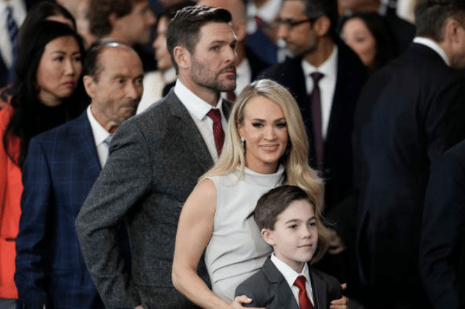 Carrie Underwood, Mike Fisher, and their son, Isaiah, attend the Inaugural Luncheon