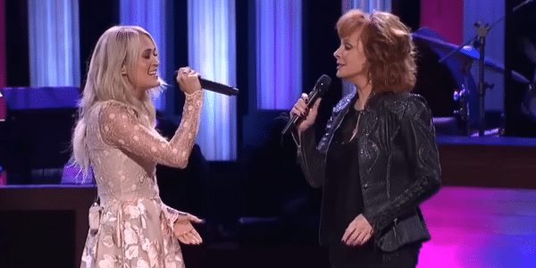 Carrie Underwood makes surprise appearance at Grand Ole Opry to sing with Reba McEntire