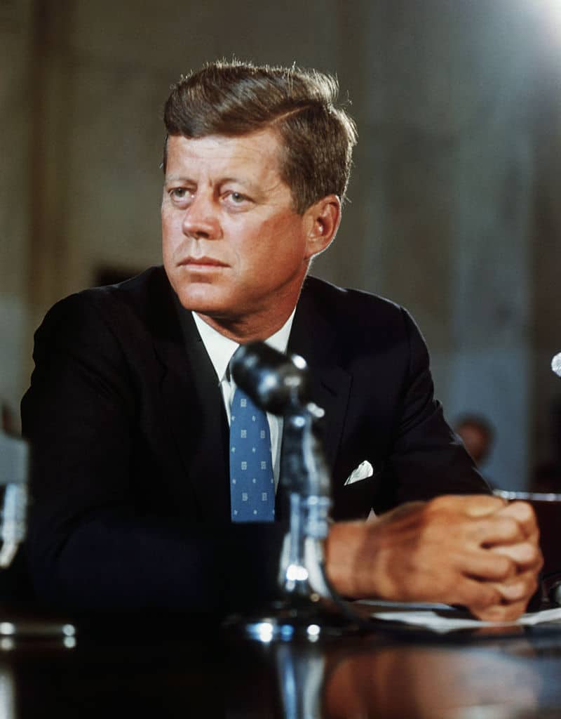 President John F. Kennedy at his desk in the White House