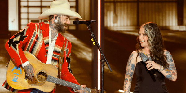 Ashley McBryde and Post Malone sing together during the "Opry 100" TV special.