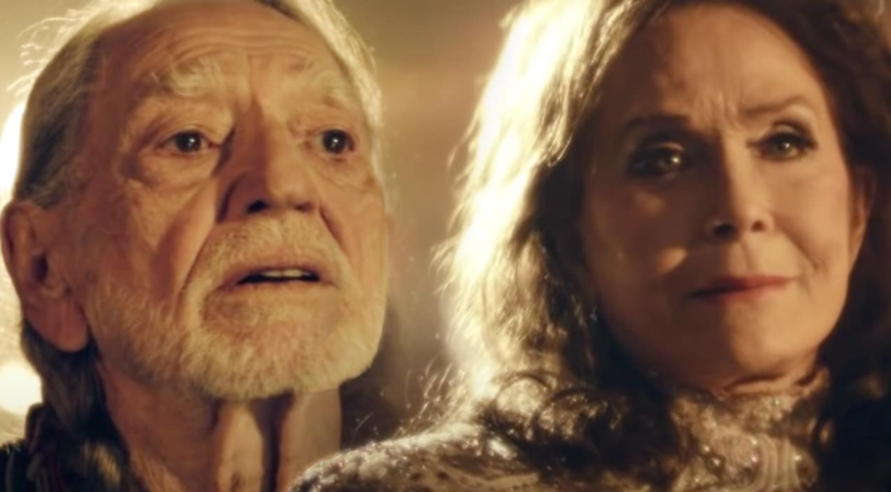 Loretta Lynn and Willie Nelson in their music video for "Lay Me Down"