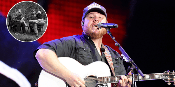 Luke Combs performing with his guitar.