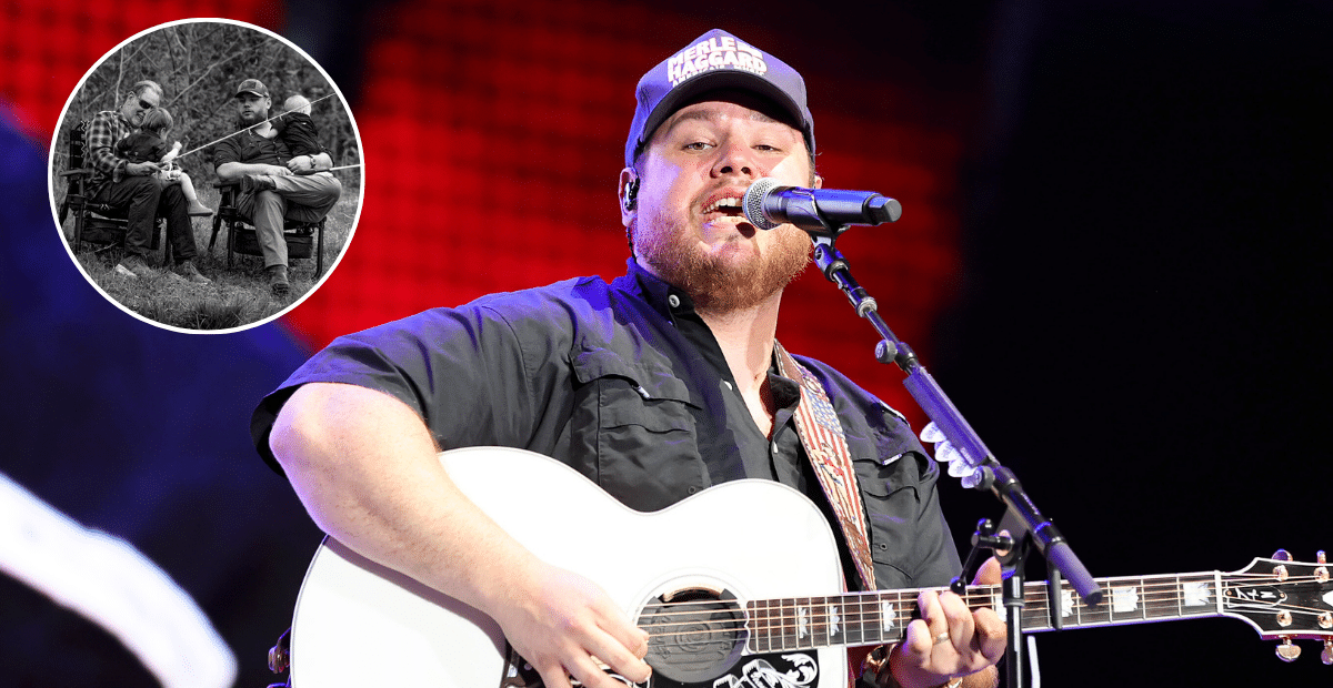 Luke Combs performing with his guitar.