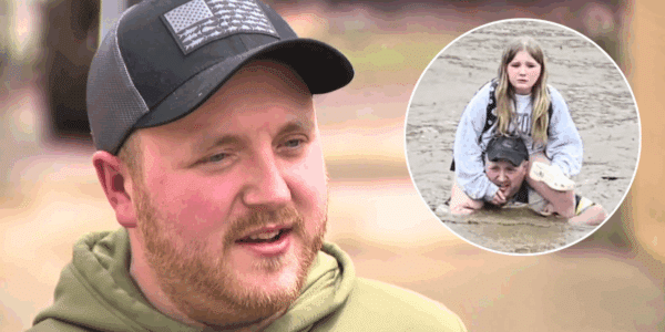 Father saves daughter in rising floodwaters.