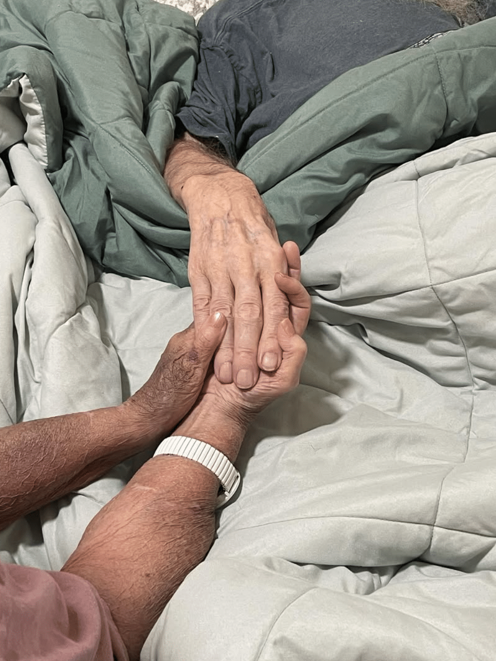 Phil and Kay Robertson hold hands during the last moments of his life