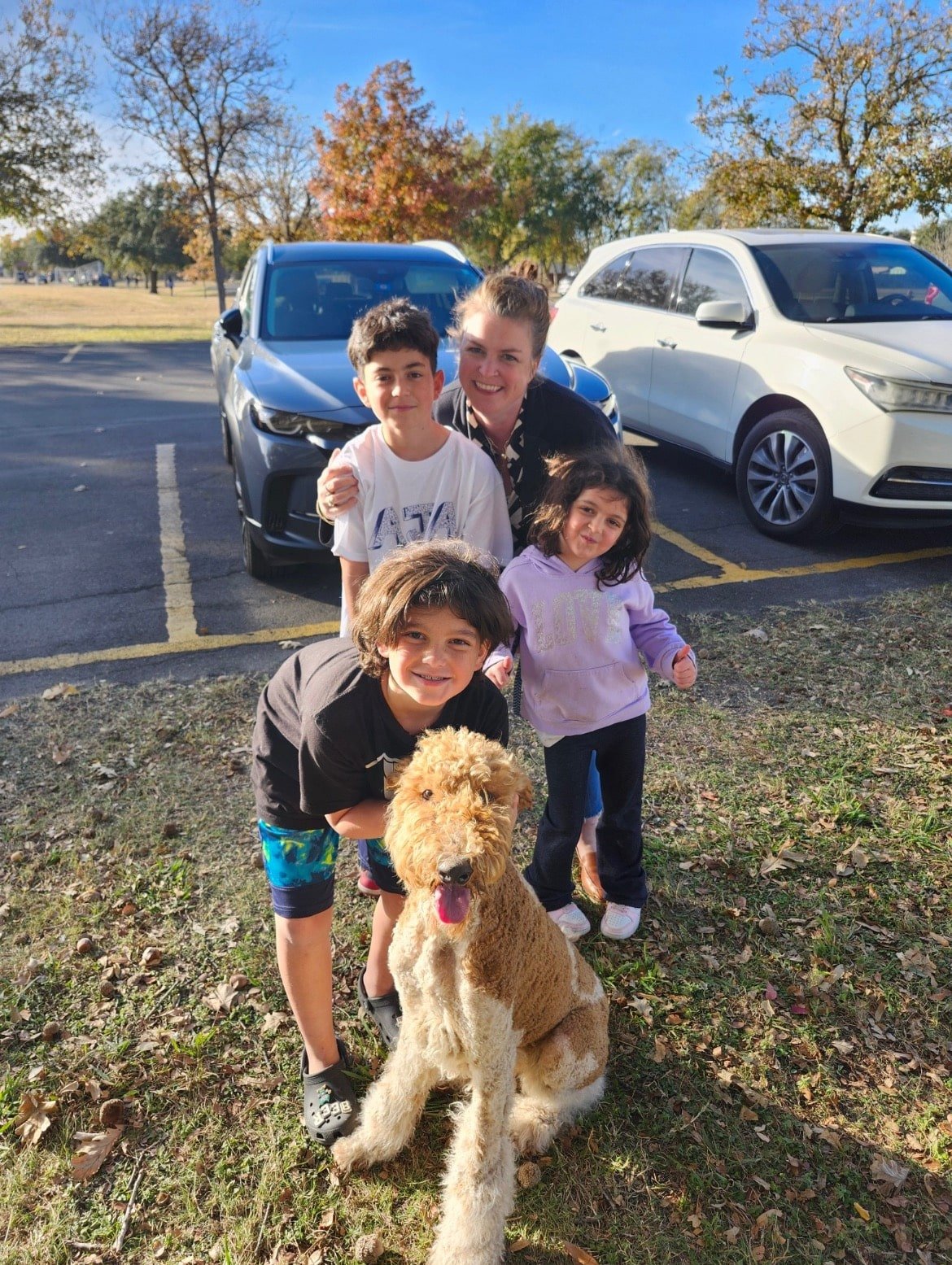 one woman, three kids, and a dog