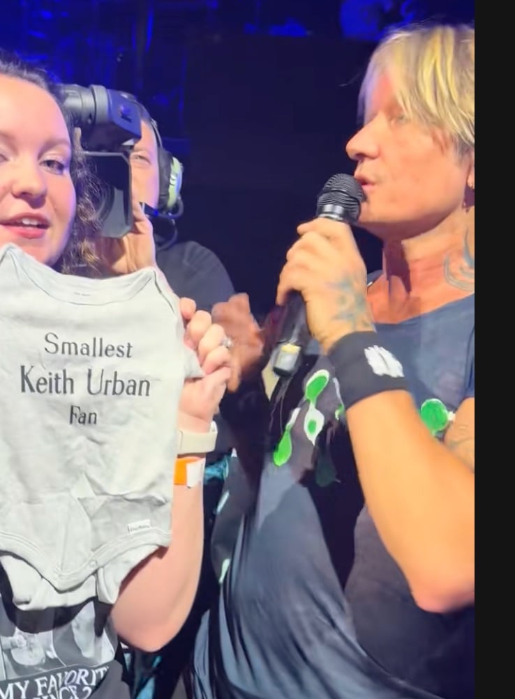 Keith Urban fan shows off onesie to announce her pregnancy