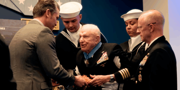 For acts of gallantry done during the Korean War in 1952, retired Navy Capt. E. Royce Williams, 100, was inducted into the Pentagon's Hall of Heroes. Here, Williams can be seen as he is presented with the Medal of Honor Flag by Sec. of War Pete Hegseth.