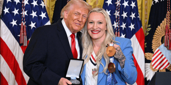 During a Women's History Month event at the White House, President Trump recognized Olympian Kaillie Humphries, who then presented Trump with the Order of Ikkos medal.