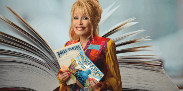 Dolly Parton holding books imagination library