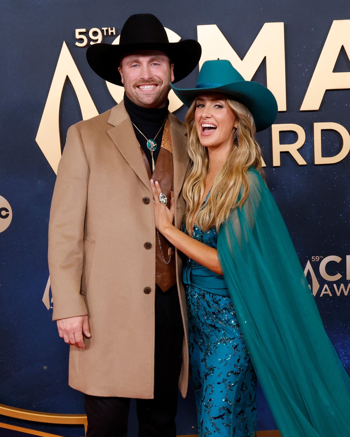 NASHVILLE, TENNESSEE - NOVEMBER 19: (EDITORIAL USE ONLY) Devlin Hodges and Lainey Wilson attend the 2025 CMA Awards at Music City Center on November 19, 2025 in Nashville, Tennessee.