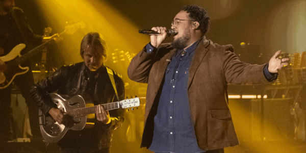 Jordan McCullough sings on stage