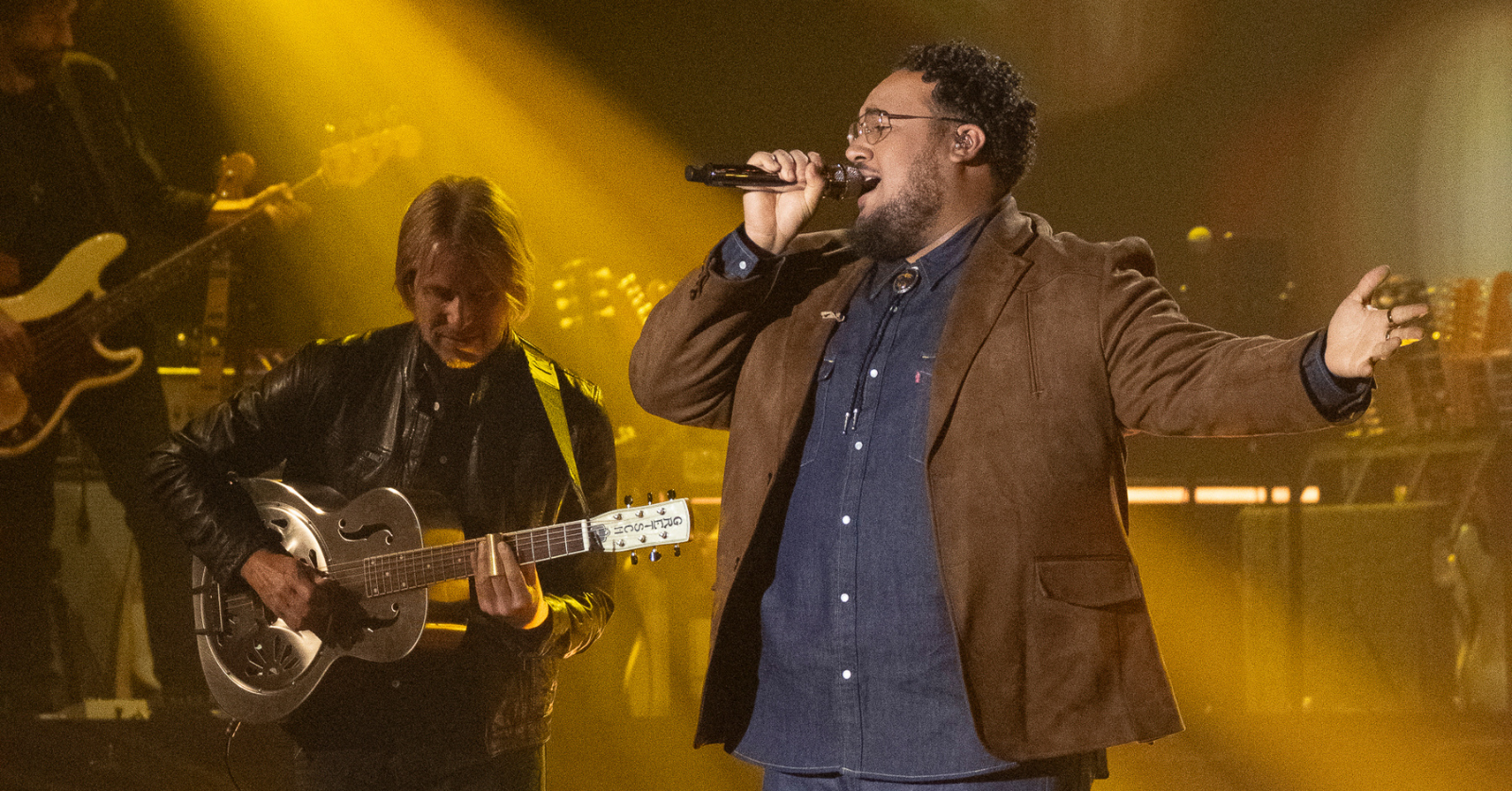 Jordan McCullough sings on stage