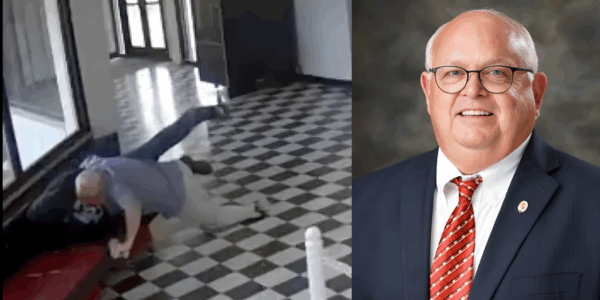 principal kirk moore holding down gunman