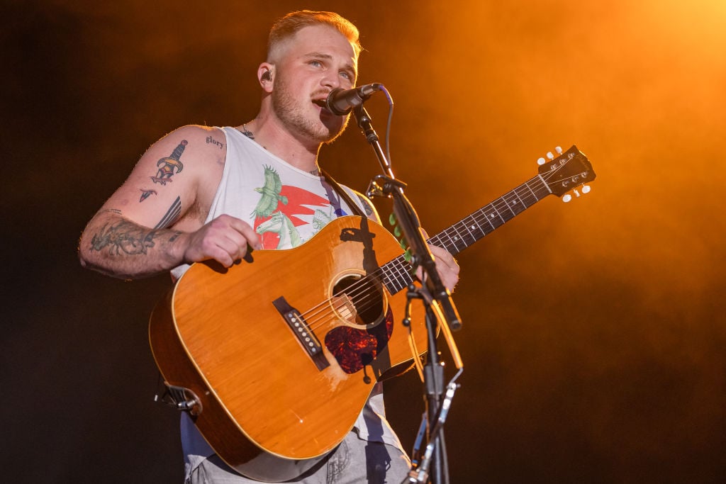 CHICAGO, ILLINOIS - JULY 13: Zach Bryan performs during the Windy City Smokeout at the United Center on July 13, 2023 in Chicago, Illinois. 