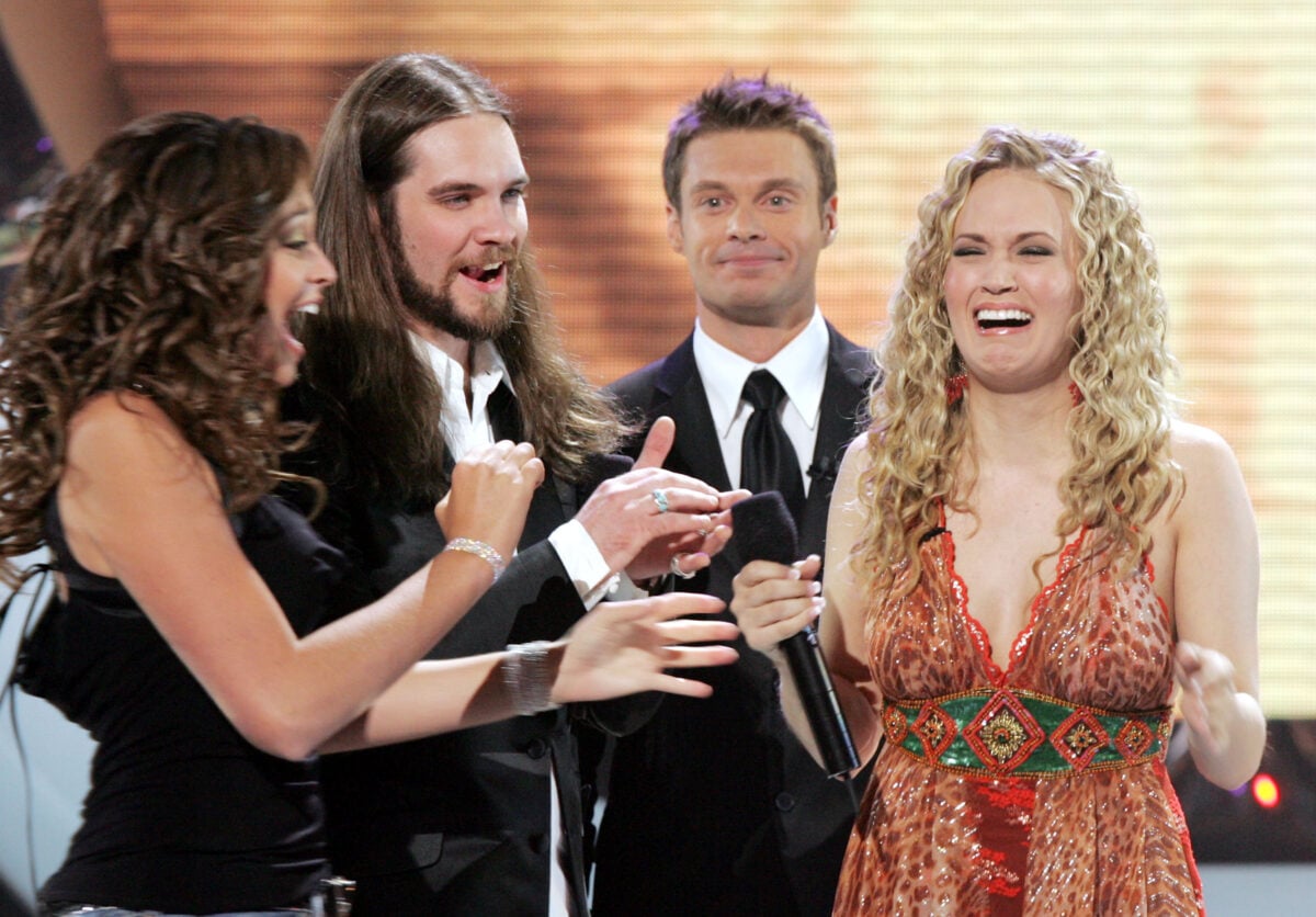 HOLLYWOOD - MAY 25: Singer Carrie Underwood (R) is named the new American Idol by host Ryan Seacrest (C) as American Idol finalist Bo Bice (L) and friend look on during Singer Carrie Underwood is named the new American Idol onstage during the American Idol Finale: Results Show held at the Kodak Theatre on May 25, 2005 in Hollywood, California