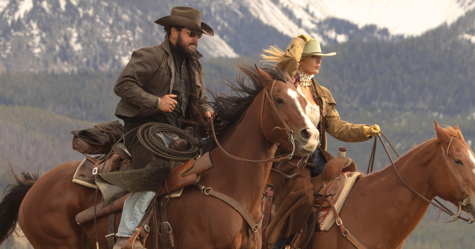 Cole Hauser and Kelly Reilly as Beth Dutton and Rip Wheeler riding horses in the Yellowstone spin-off Dutton Ranch, which broke the record for the biggest series premiere on Paramount+