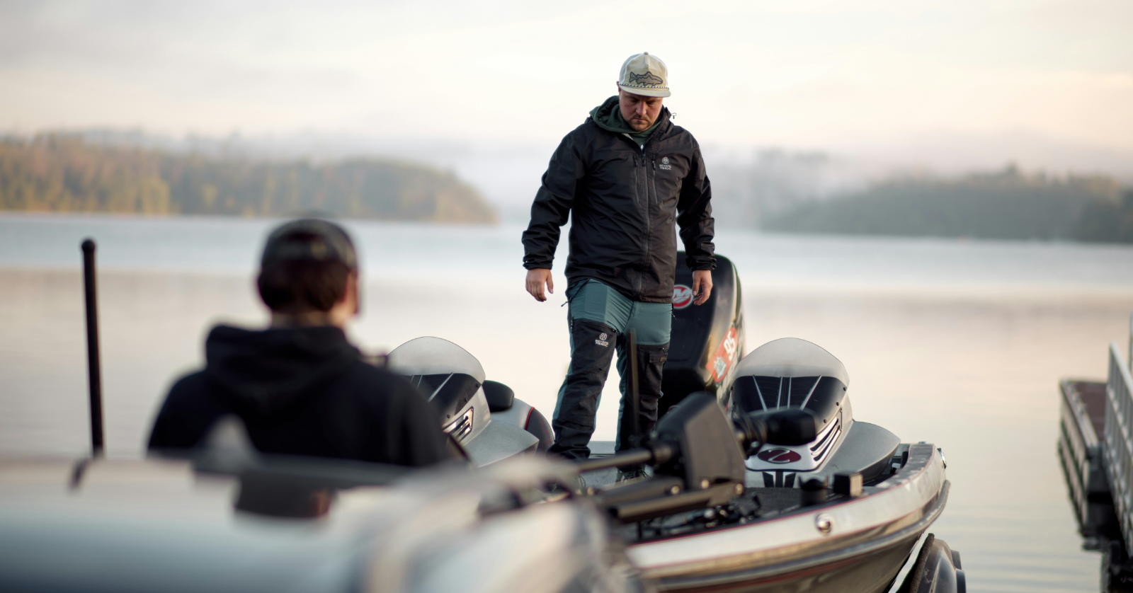 two men in a bass fishing boat
