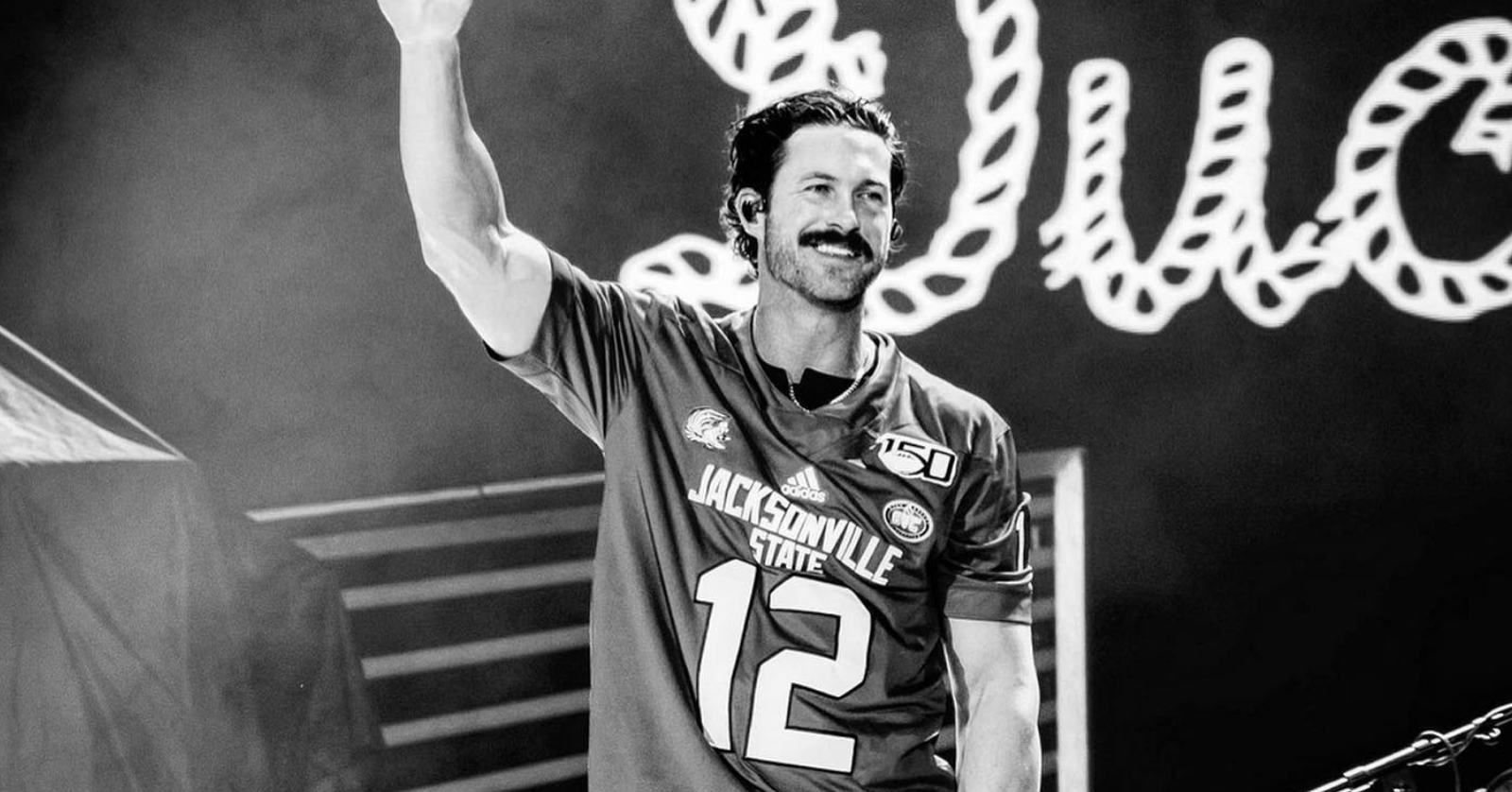 riley green in a football jersey